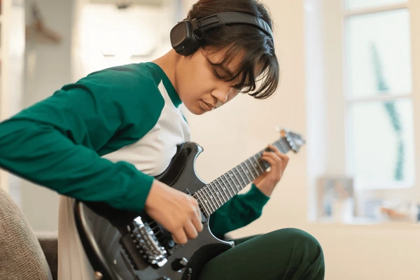 Young Boy Playing Guitar