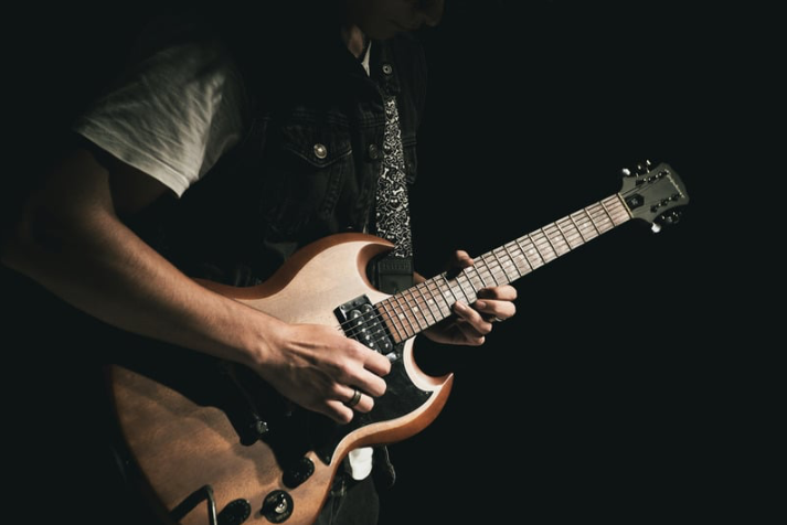 A man deciding whether guitar lessons are worth it or not
